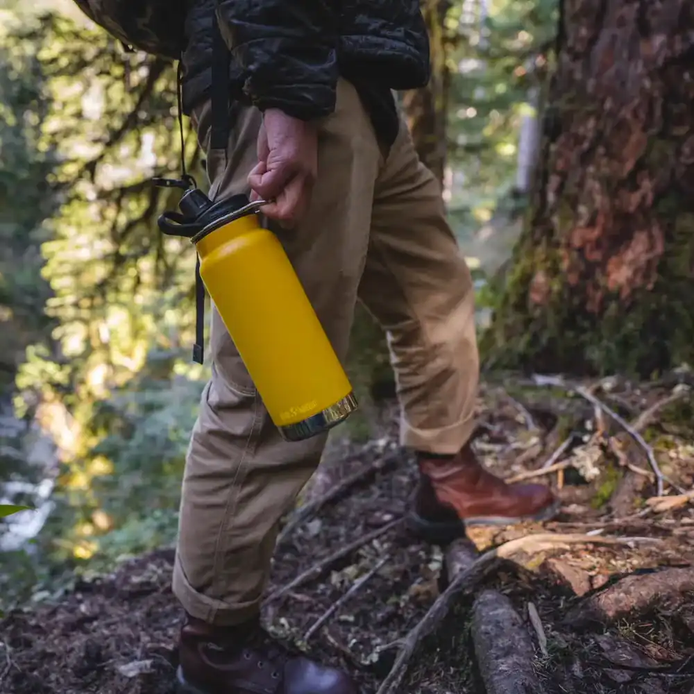 a man carring a stainless steel water bottle on travel